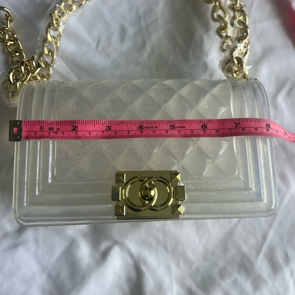 Elegant transparent padded bag with golden details are two bags for only 35